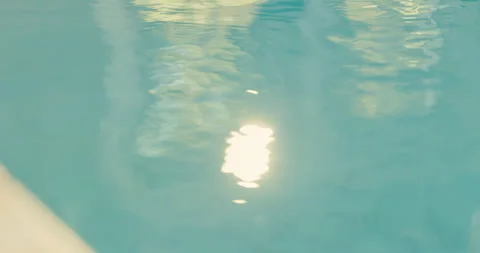 Water, light or reflection with ripples in spa for luxury getaway, peace or Stock Footage 345580437