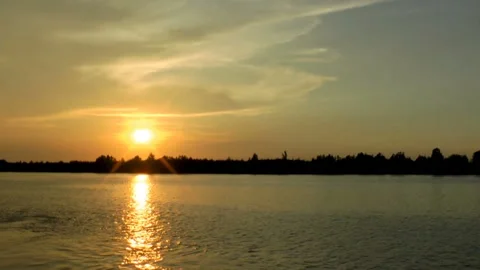 Water lit by the setting sun at sunse Stock Footage 134409367