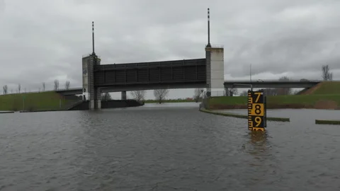 Water lock open during river floodings in the Netherlands Stock Footage 259847783