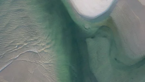 Water magic on a sandbar Stock Footage 250249790