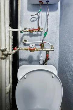 Water meter assembly includes brass utility valves and flexible hoses conne.. Stock Photos