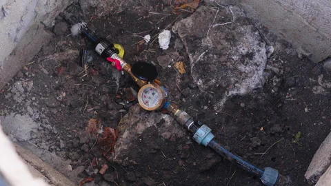 Water meter installation process showing sequential frames of a meter in a Stock Footage 319534940