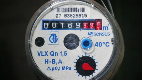 Water meter reading the flow rate of the consumed liquid. Stock Footage 167848826