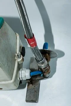 Water meter verification process. The account is connected to a water tap. .. Stock Photos