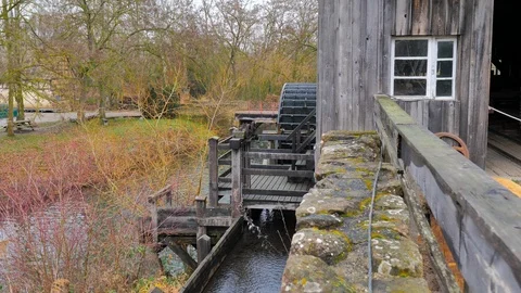 Water mill wheel structure for sawmill rotating with channeled water Stock Footage 124472247