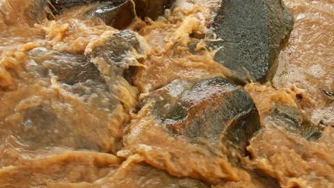 Water from mountain changes color after heavy rain. Stock Footage 80155670