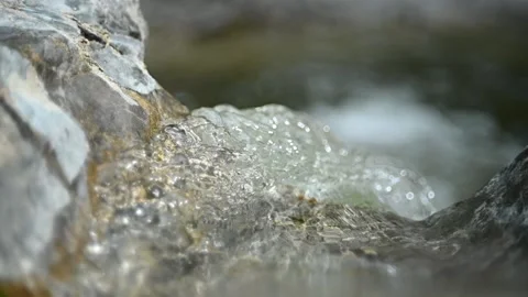 Water from a mountain river falling from rocks (slow motion, bokeh) Stock-Footage 212738065