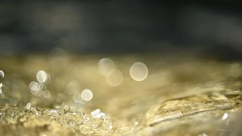 Water of a mountain river flowing over stones (bokeh slow motion, close up) 스톡 동영상 211755531