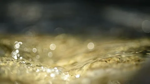 Water of a mountain river flowing over stones (slow motion, bokeh) 스톡 동영상 211755533