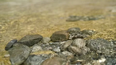 Water from a mountain river flows over stones (slow motion) Stock-Footage 219634247