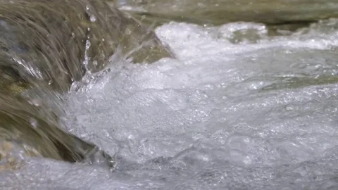 Water in a mountain river in slow motion video. Stock Footage 79096301