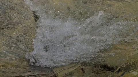 Water in a mountain river in slow motion video. Stock Footage