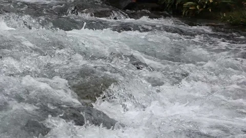 Water in a mountain stream, natural background Stock Footage 97980432