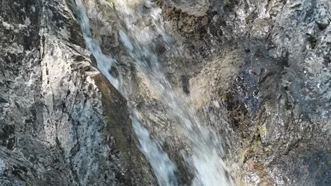 Water from a mountain stream runs over rocks in summer (slow motion) 스톡 동영상 219645711