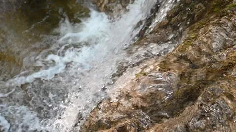 Water from a mountain stream runs over rocks (slow motion) Stock Footage 219646871