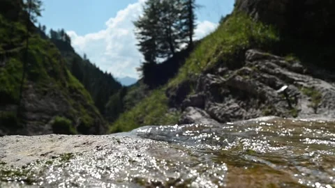 Water from a mountain stream on the top of a waterfall (slow motion) Video stock 219637709