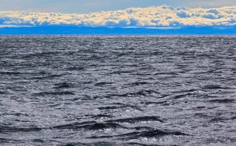 Water, mountains and clouds Stock Photos
