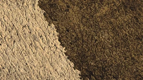 Water move through surface with rough texture Stock Footage 284304883