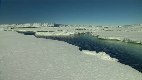 Water moving through the cracks in ice Video stock 114724837