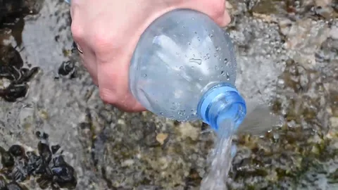 The water from the natural spring is crystal clear cool for drinking and cooking Stock Footage 89610850
