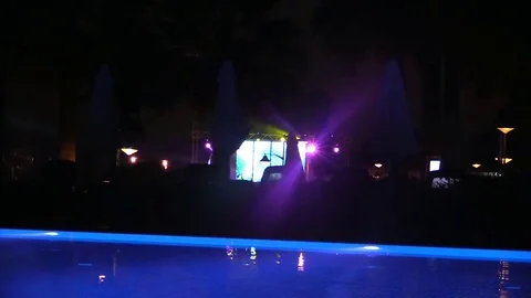 Water of night pool with illumination in background of disco music stage Stock Footage 78605793