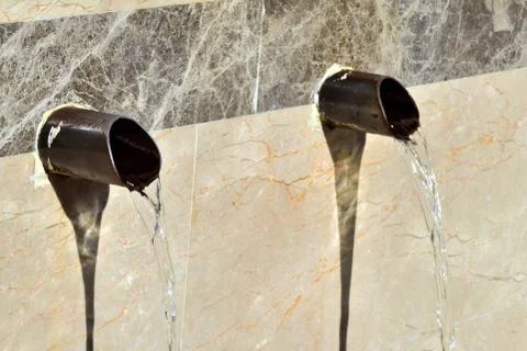 Water from old pump Stock Photos