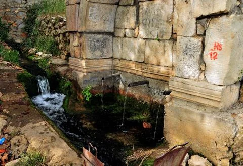 Water from old pump Stock Photos