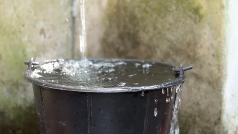 The water is opened to flow into the water tank until overflowing. Stock Footage 124455517