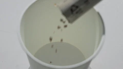 Water or Liquid Poured into White Bowl Overhead View Stock Footage 340243580