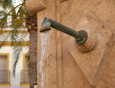 Water outlet through a pipe Stock Photos