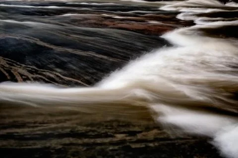 Water over stone Stock Photos
