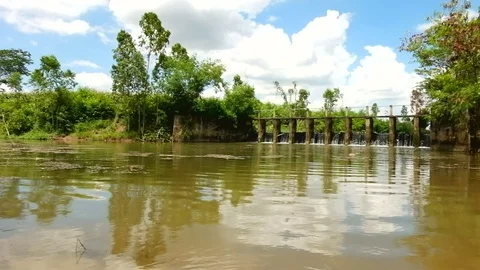 A water overflow concrete weir Stock Footage 77615327