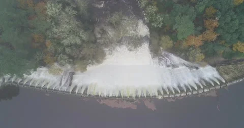 Water overflowing from a dam surrounded by native forest in Galicia. Spain. Stock Footage 161595405