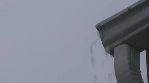 Water Overflowing from end of gutter on house during heavy rain Stock Footage 66724482