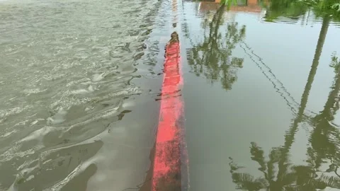 Water overflows from rivers, causing floods on the street Stock Footage 294854388