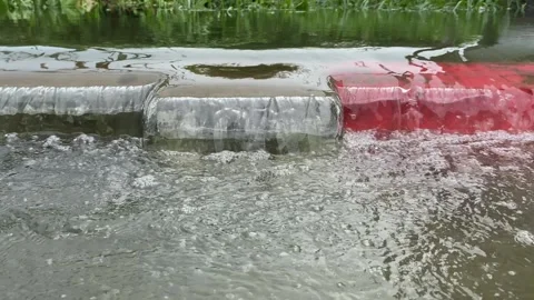 Water overflows from rivers, causing floods on the street Stock Footage 294854429