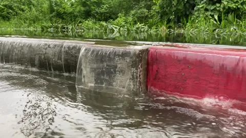 Water overflows from rivers, causing floods on the street Stock Footage 294854456