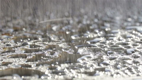 Water particles falling on wet surface close up Stock Footage 125460545