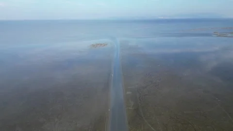 A water path is shown in the distance with a body of water in the background 스톡 동영상 325840458