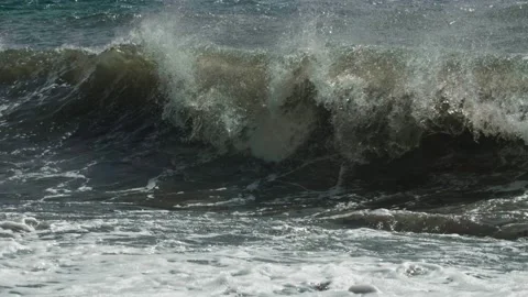 A water pipe breaks on the shore during a storm. A long shot taken with a tripod Stock Footage 217864308