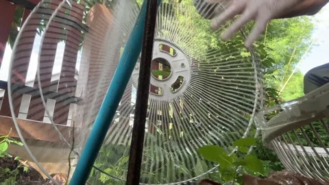 Water from pipe flow freely cleaning dirt and dust form fan grill and blade 動画素材 337846820