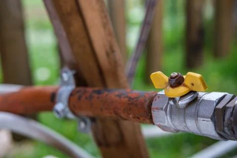 Water pipe with a tap. Stock Photos