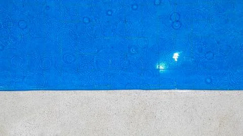 Water in the pool with raindrops Stock Photos