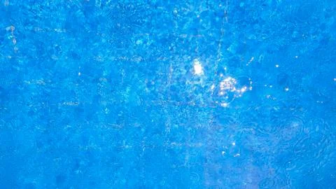 Water in the pool with raindrops Stock Photos