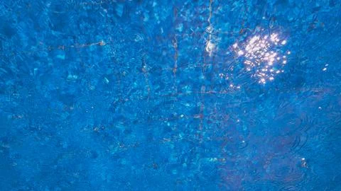 Water in the pool with raindrops Stock Photos