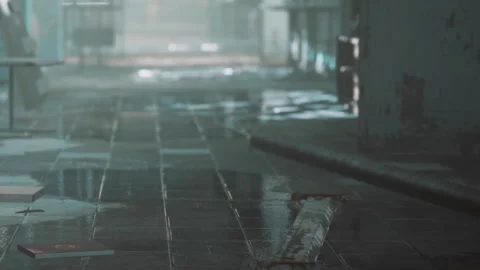 Water pooled on the floor of a building during a rainy day in a city Stock Footage 339873557