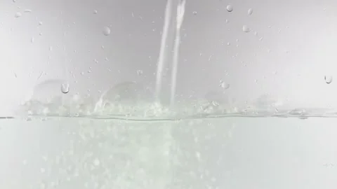 Water is poured into a container Stock Footage 175445334