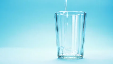 Water is poured into a glass Stock Footage 120577857