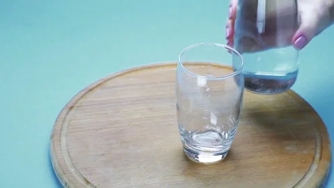 Water is poured into a glass Stock Footage 120578807