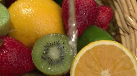 Water poured over fresh fruit Stock Footage